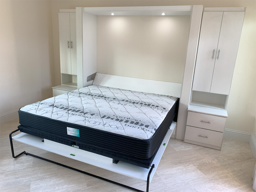 King Murphy bed installed in Fort Lauderdale with built-in cabinets and overhead lighting